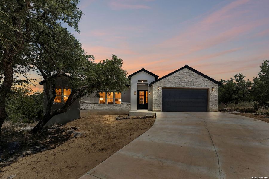 Front exterior of a new home in , Horseshoe Bay, TX, highlighting curb appeal (Image 25). Front exterior of a new home in , Horseshoe Bay, TX, highlighting curb appeal (Image 25).