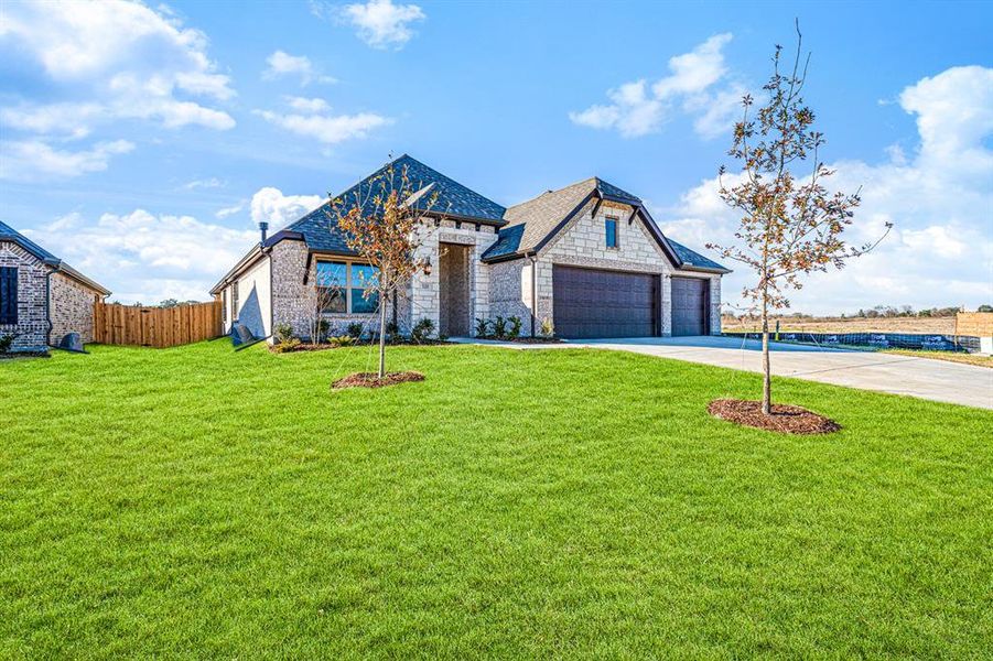 Front exterior of a new home in , Greenville, TX, highlighting curb appeal (Image 18).