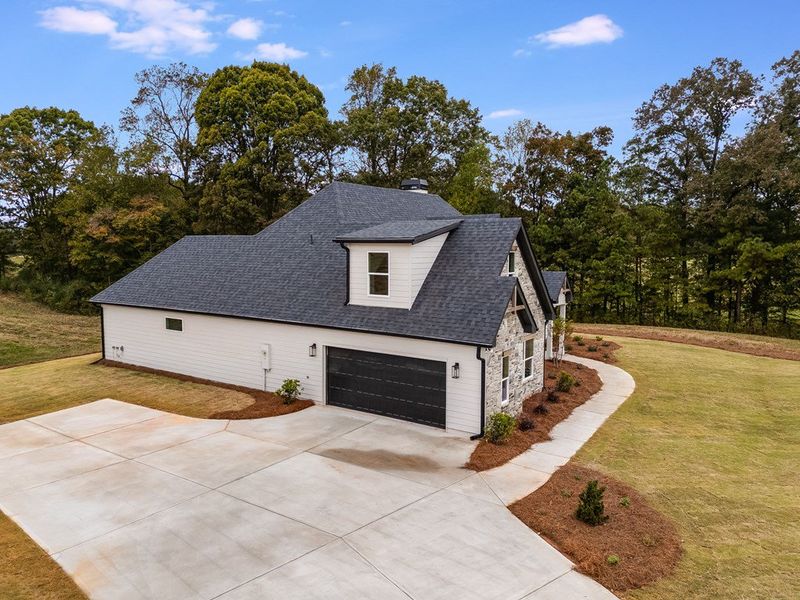 Front exterior of a new home in Parmer Farms, Roopville, GA, highlighting curb appeal (Image 23).