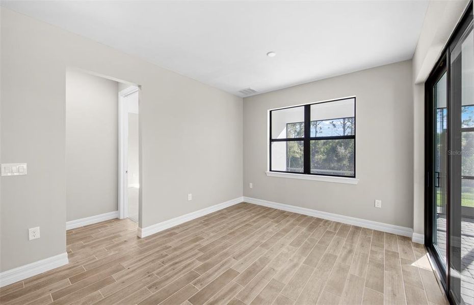 Spacious, unfurnished interior of a new home in Cedar Grove at The Woodlands, North Port (Image 29).