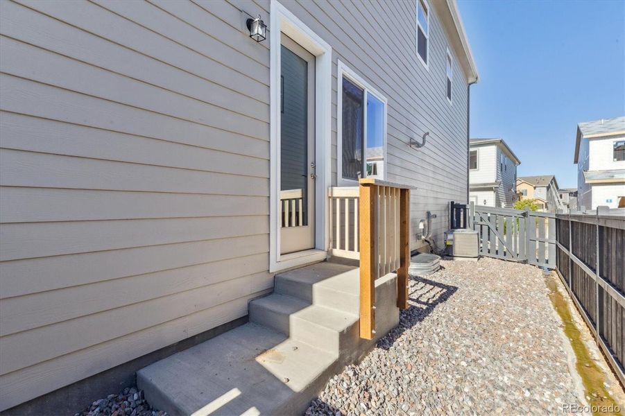 Exterior details and patio area of a home in Paired Homes at Alder Creek, Parker (Image 3).