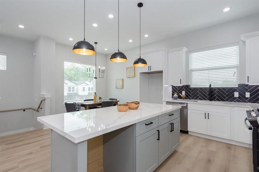 A dedicated space for a wine fridge or rack adds a touch of luxury and convenience, perfect for keeping your favorite bottles at the ideal temperature.