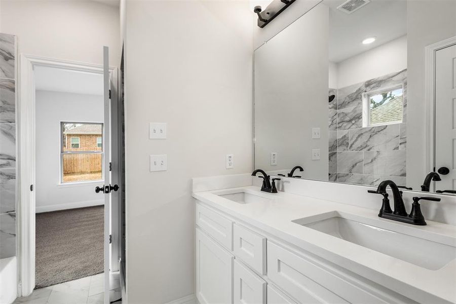 Dual Sinks and custom cabinetry.