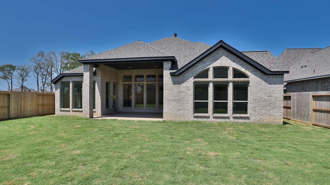 Front exterior of a new home in Riceland 60', Mont Belvieu, TX, highlighting curb appeal (Image 1). Front exterior of a new home in Riceland 60', Mont Belvieu, TX, highlighting curb appeal (Image 1).