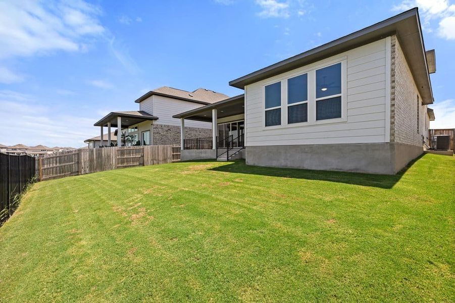 Exterior details and patio area of a home in Lariat, Liberty Hill (Image 31).