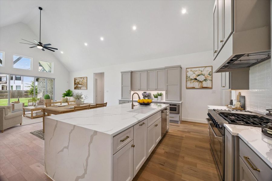 Kitchen, Dining, and Living. This photo has been virtually staged.