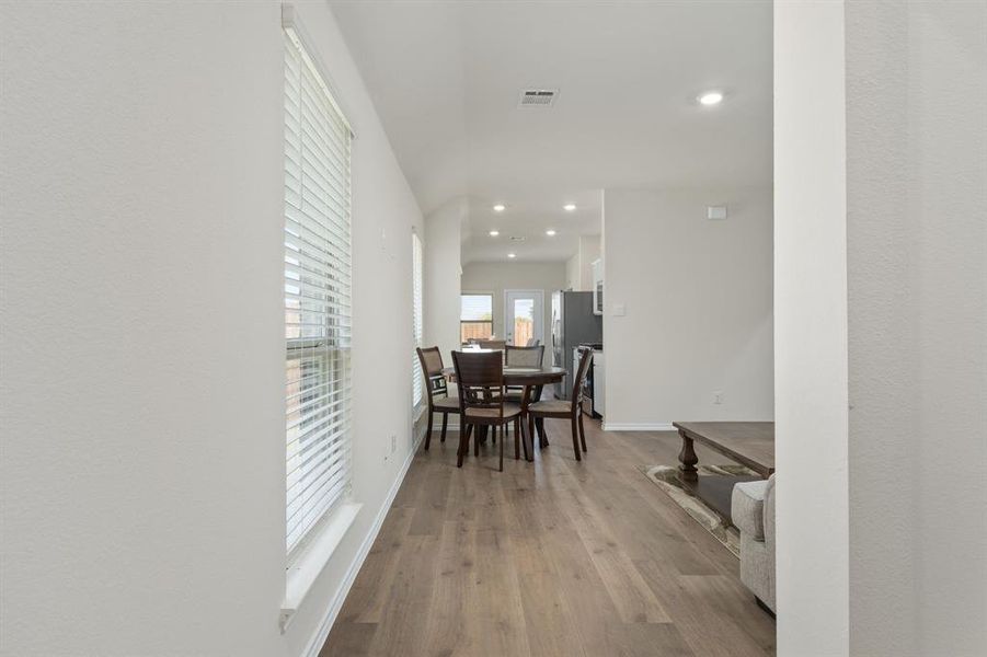Corridor featuring light wood-style floors and recessed lighting Corridor featuring light wood-style floors and recessed lighting