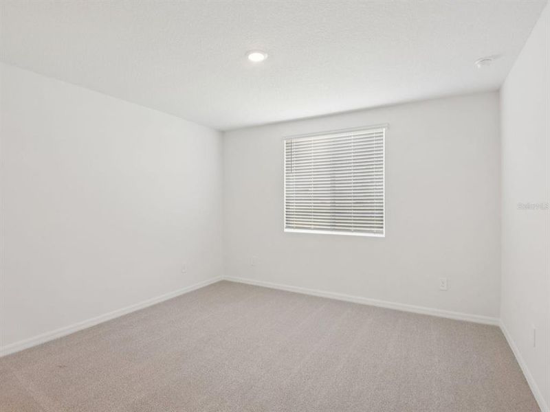 Spacious, unfurnished interior of a new home in The Grove at Stuart Crossing - Classic Series, Bartow (Image 10).