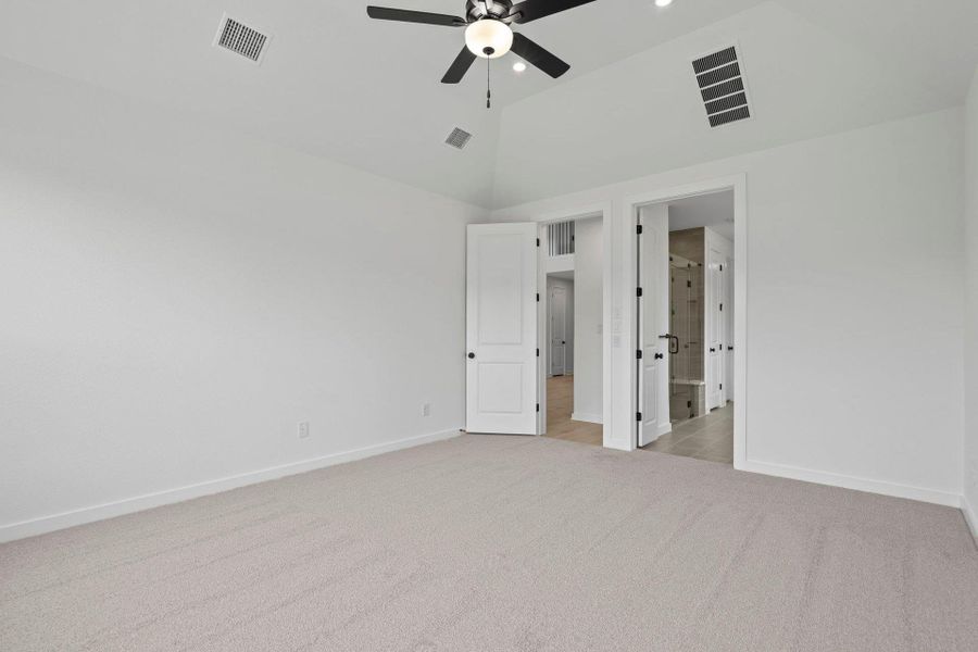 Primary Bedroom with elevated ceiling Primary Bedroom with elevated ceiling