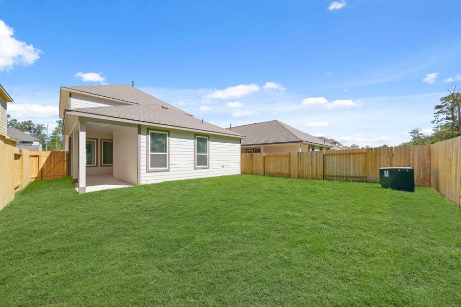 Exterior details and patio area of a home in Cypresswood Landing, Humble (Image 15).