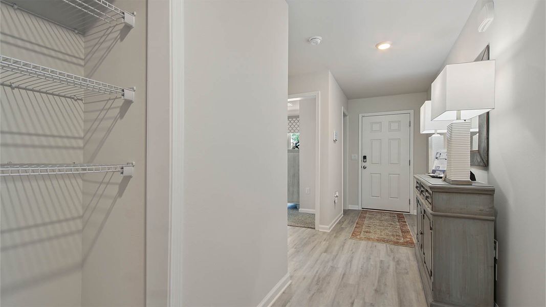 Representative furnished interior of a home built from the Cali by D.R. Horton in Owl's Head East, Freeport (Image 29).