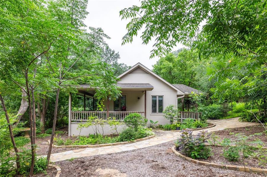 Your own little guest cottage with a porch that wraps along half of the structure