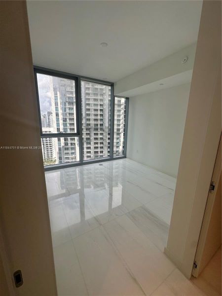 Spacious, unfurnished interior of a new home in Aston Martin Residences, Miami (Image 10).