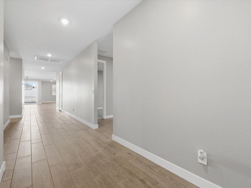 Spacious, unfurnished interior of a new home in Blossom Rock Reserve Series, Apache Junction (Image 15). Spacious, unfurnished interior of a new home in Blossom Rock Reserve Series, Apache Junction (Image 15).