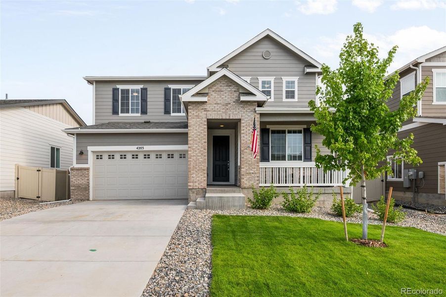 Exterior details and patio area of a home in Thompson River Ranch, Johnstown (Image 19).