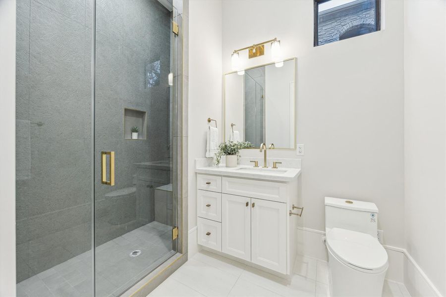 En-suite bath has a walk-in shower.