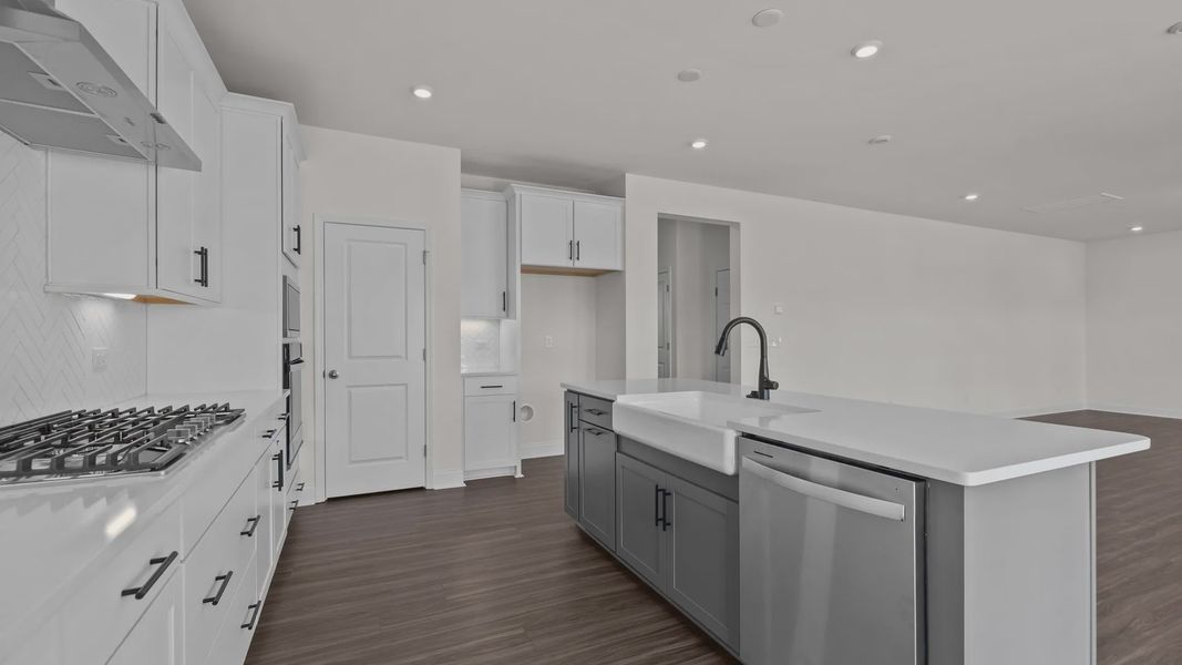 Burton Design gourmet kitchen with large island. At Lakeside Glen by DRB Homes in York, SC. Burton Design gourmet kitchen with large island. At Lakeside Glen by DRB Homes in York, SC.