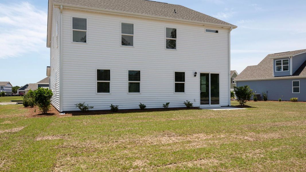 Exterior details and patio area of a home in Indigo Preserve, Leland (Image 21).