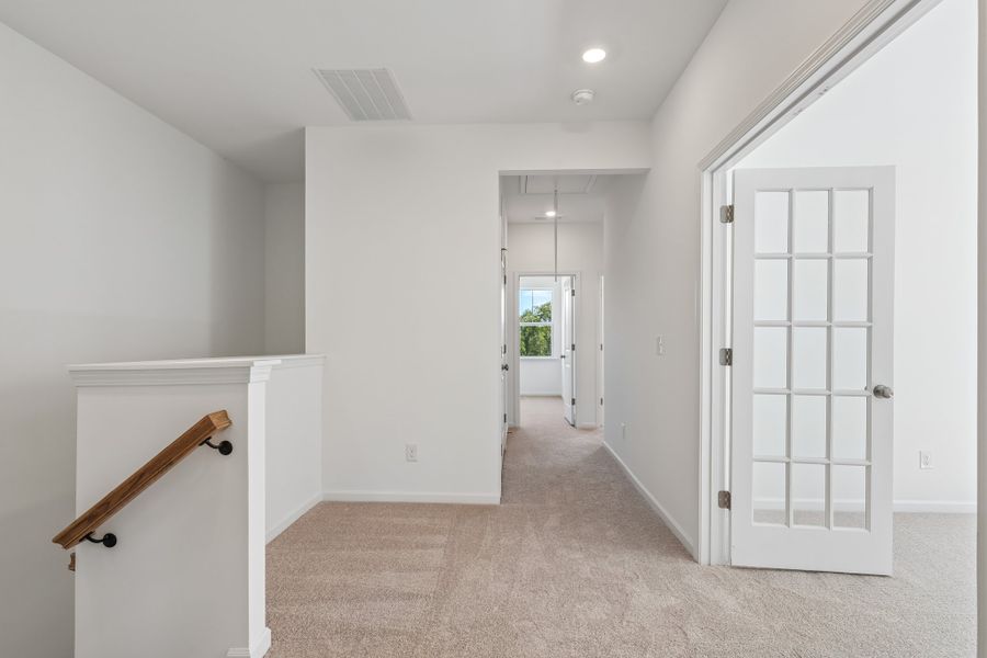 Spacious, unfurnished interior of a new home in Terraces at the Exchange, Indian Land (Image 15).