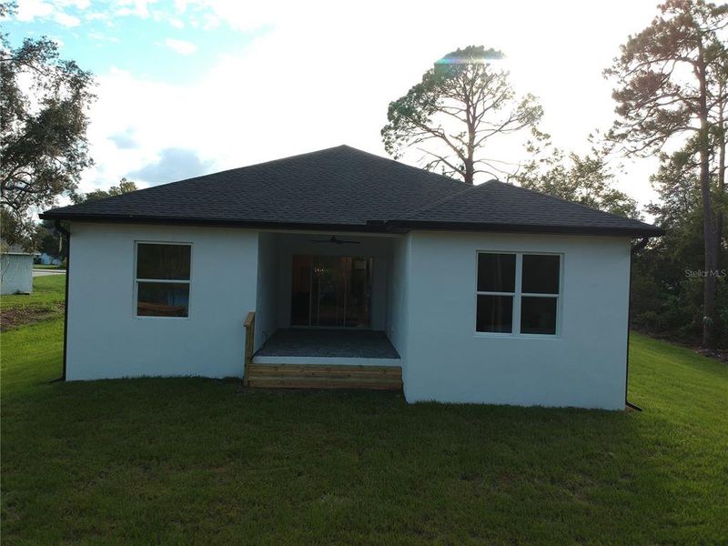 Front exterior of a new home in , Deltona, FL, highlighting curb appeal (Image 26). Front exterior of a new home in , Deltona, FL, highlighting curb appeal (Image 26).