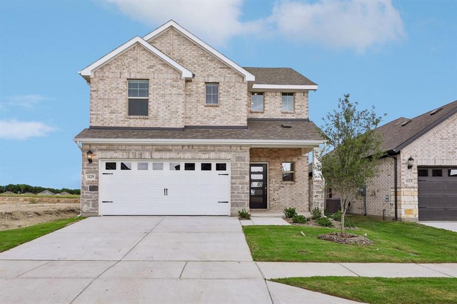 Front exterior of a new home in Parks at Foster Crossing - Spring Series, Anna, TX, highlighting curb appeal (Image 1). Front exterior of a new home in Parks at Foster Crossing - Spring Series, Anna, TX, highlighting curb appeal (Image 1).