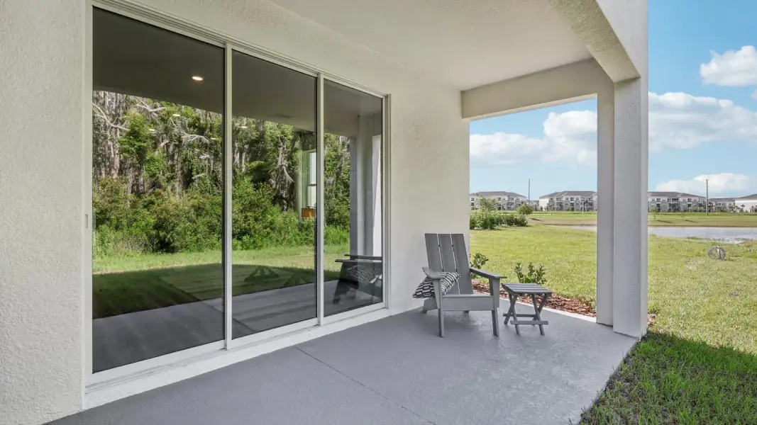 Exterior details and patio area of a home in Towns at Woodsdale, Wesley Chapel (Image 3).