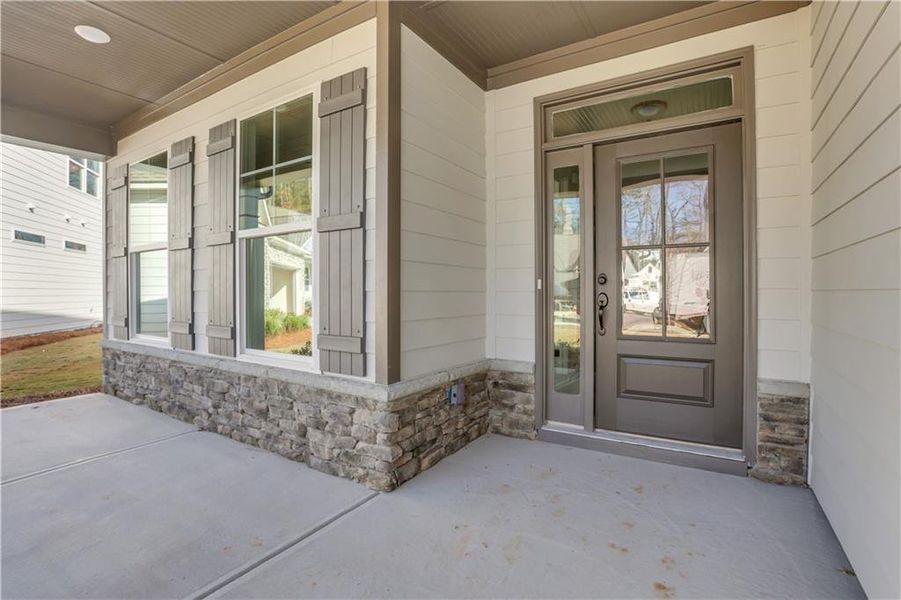 Exterior details and patio area of a home in Marble Tree, Ball Ground (Image 24).