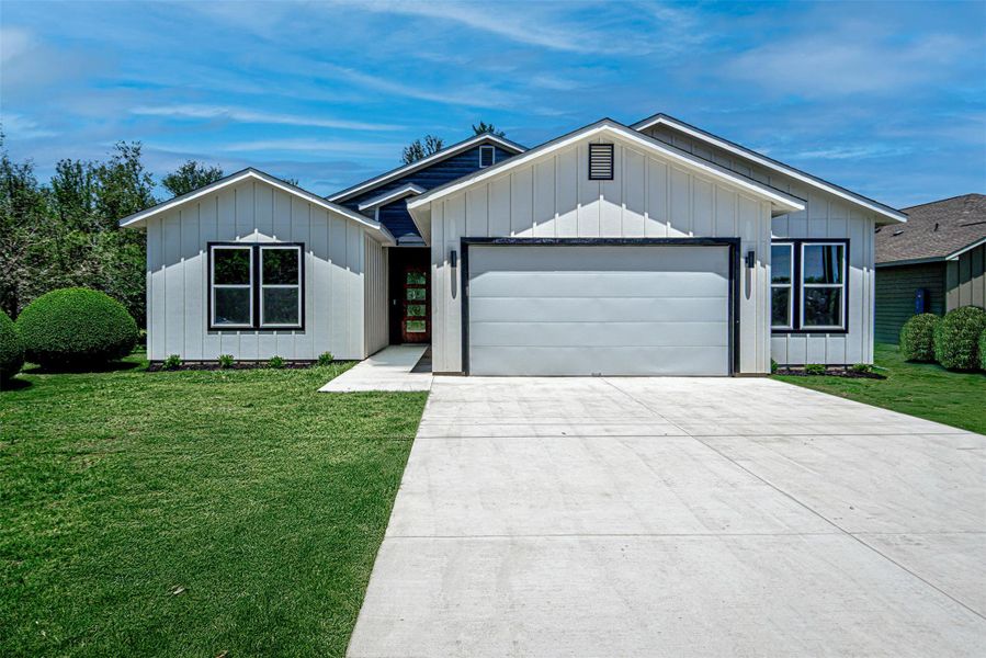 Front of home on flat lot.