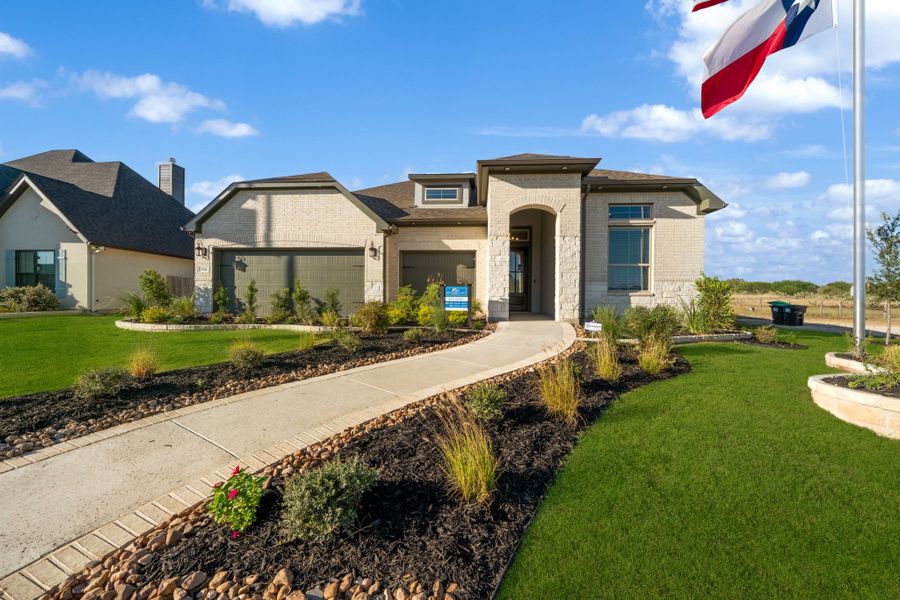 Front exterior of a new home in Country Village Estates, Castroville, TX, highlighting curb appeal (Image 1). Front exterior of a new home in Country Village Estates, Castroville, TX, highlighting curb appeal (Image 1).