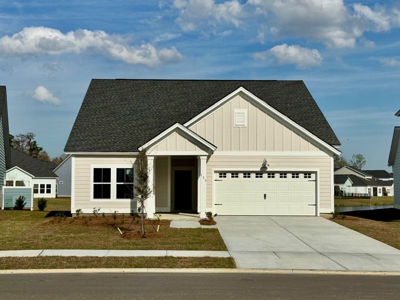 Front exterior of a new home in Savannah Quarters, Pooler, GA, highlighting curb appeal (Image 1). Front exterior of a new home in Savannah Quarters, Pooler, GA, highlighting curb appeal (Image 1).