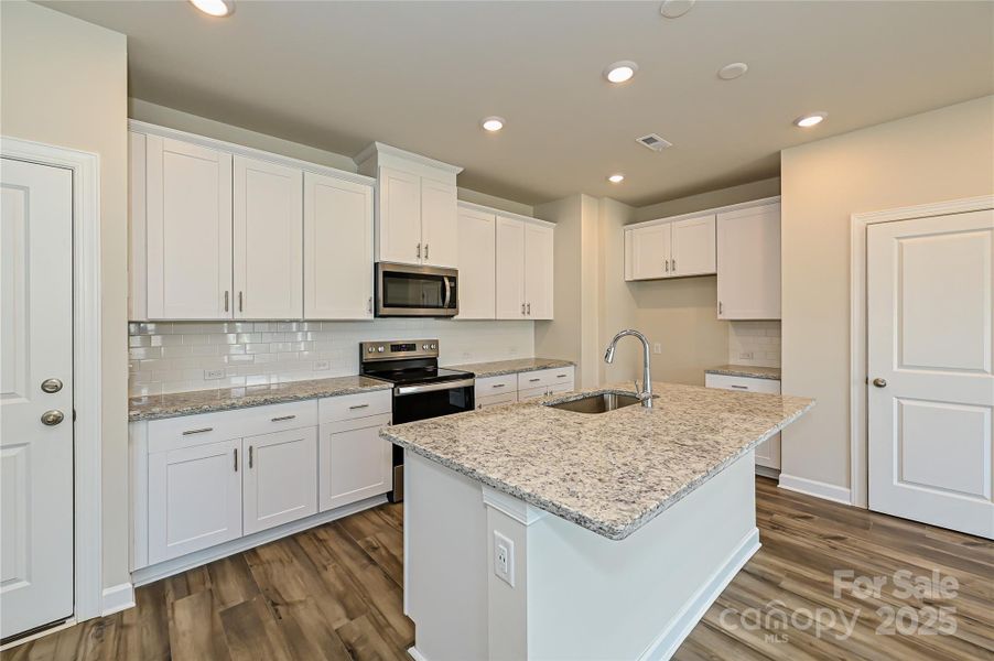 Photo is not of the actual home, but is an inspirational photo of builder’s model home and may depict options, furnishings, and/or decorator features that are not included