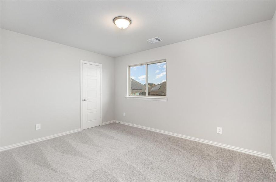 Unfurnished room featuring light carpet