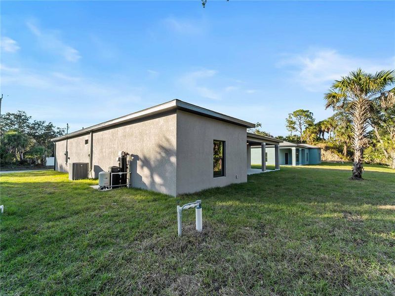 Exterior details and patio area of a home in , North Port (Image 34).