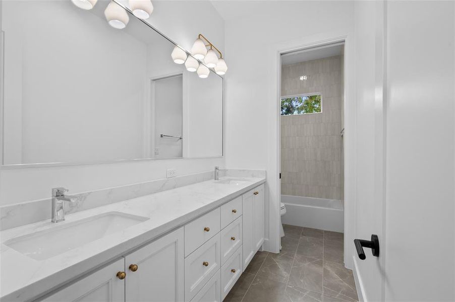 Extra large guest bathroom with custom built ins and separate private shower/toilet area.