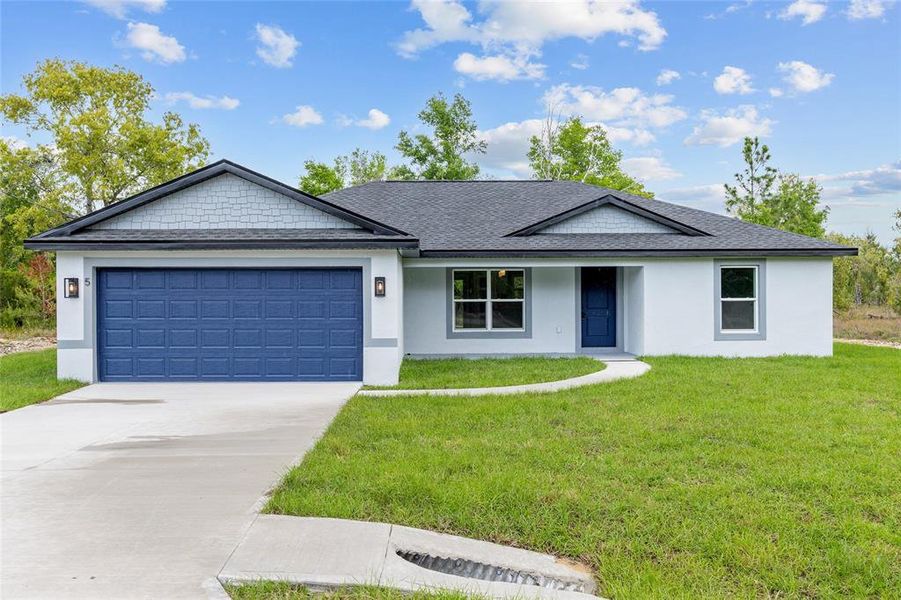 Front exterior of a new home in , Ocklawaha, FL, highlighting curb appeal (Image 22).