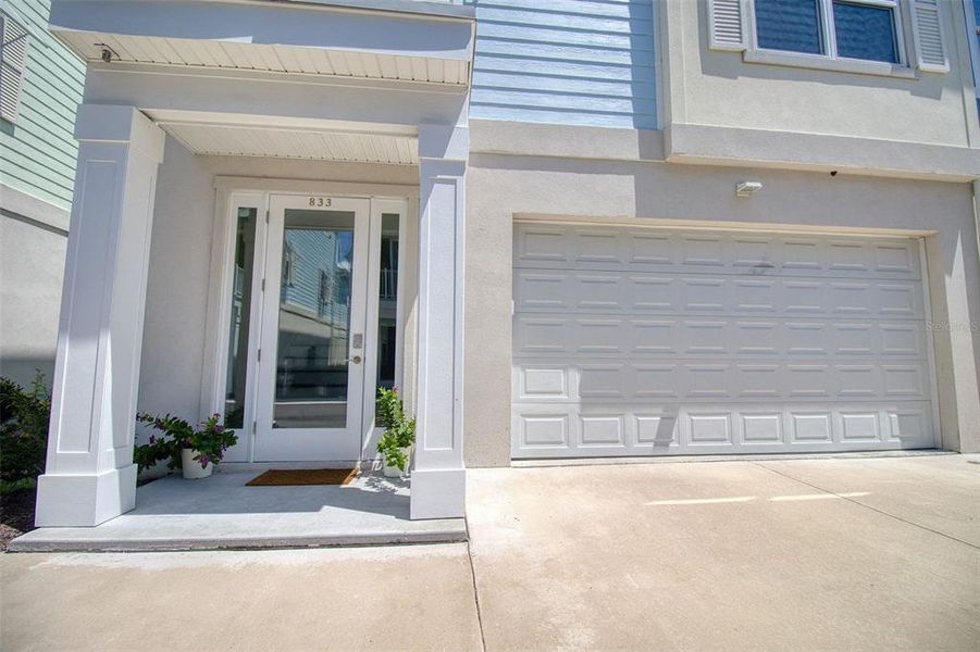 Front exterior of a new home in , Dunedin, FL, highlighting curb appeal (Image 1).