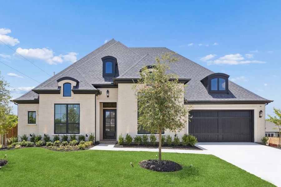 Front exterior of a new home in The Parks at Wilson Creek, Celina, TX, highlighting curb appeal (Image 1). Front exterior of a new home in The Parks at Wilson Creek, Celina, TX, highlighting curb appeal (Image 1).