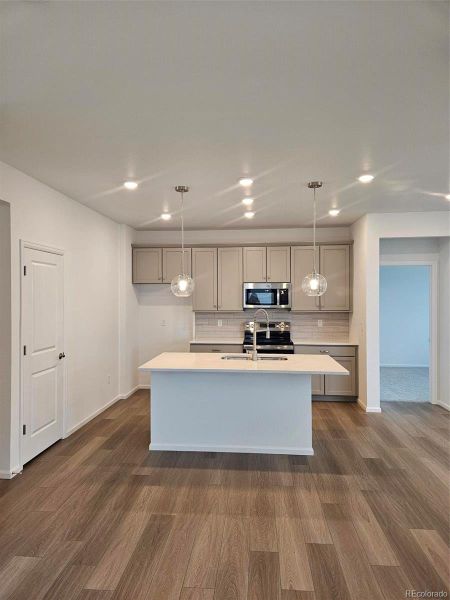 Furnished interior view inside a new home in The Cottages Collection at Ridgeline Vista, Brighton (Image 6).