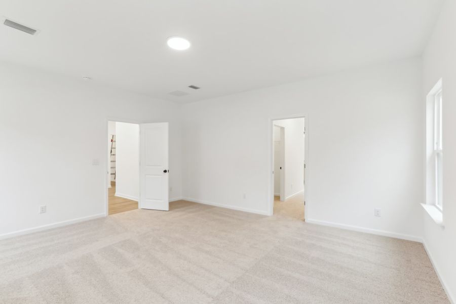 Representative unfurnished interior of a home built from the Alexis by Ashton Woods in Rowland's Grant, Fuquay Varina (Image 44).
