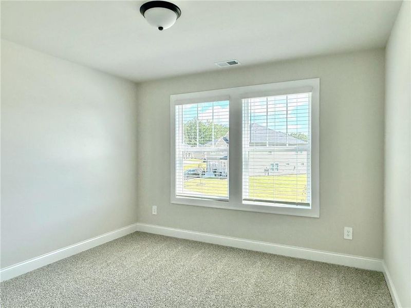 Spacious, unfurnished interior of a new home in Vines at Mill Creek - Legacy Series, Braselton (Image 12).