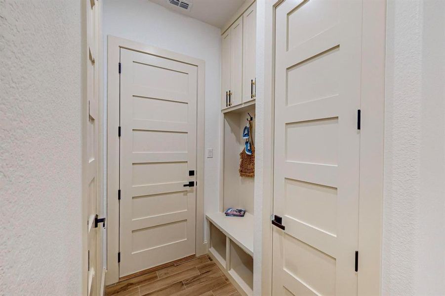 Mudroom with light wood-type flooring