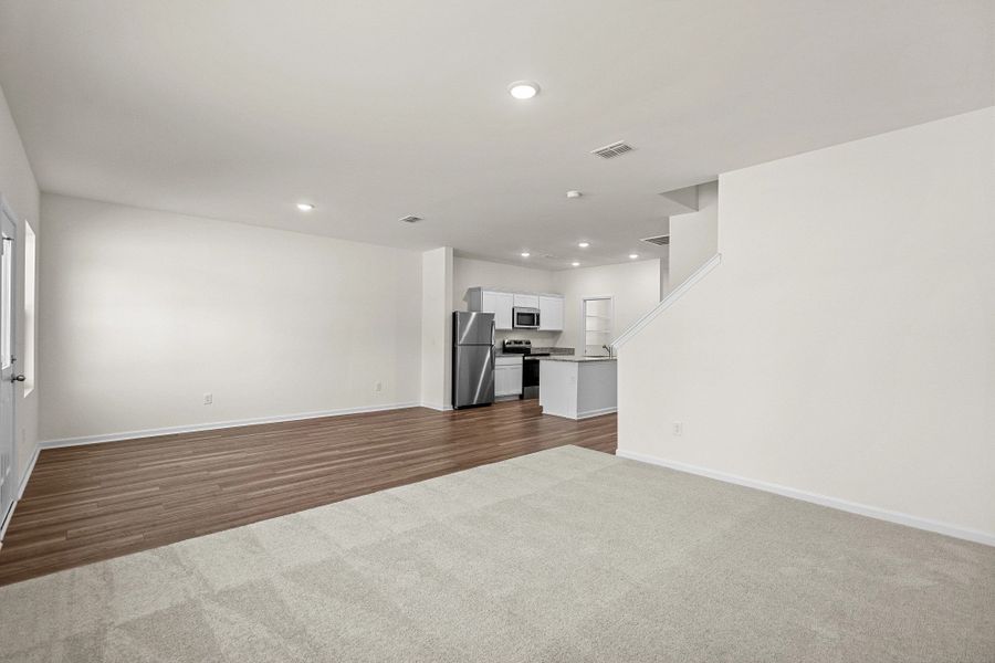 Representative unfurnished interior of a home built from the Highland by Starlight Homes in Sutton Farms, San Antonio (Image 15).