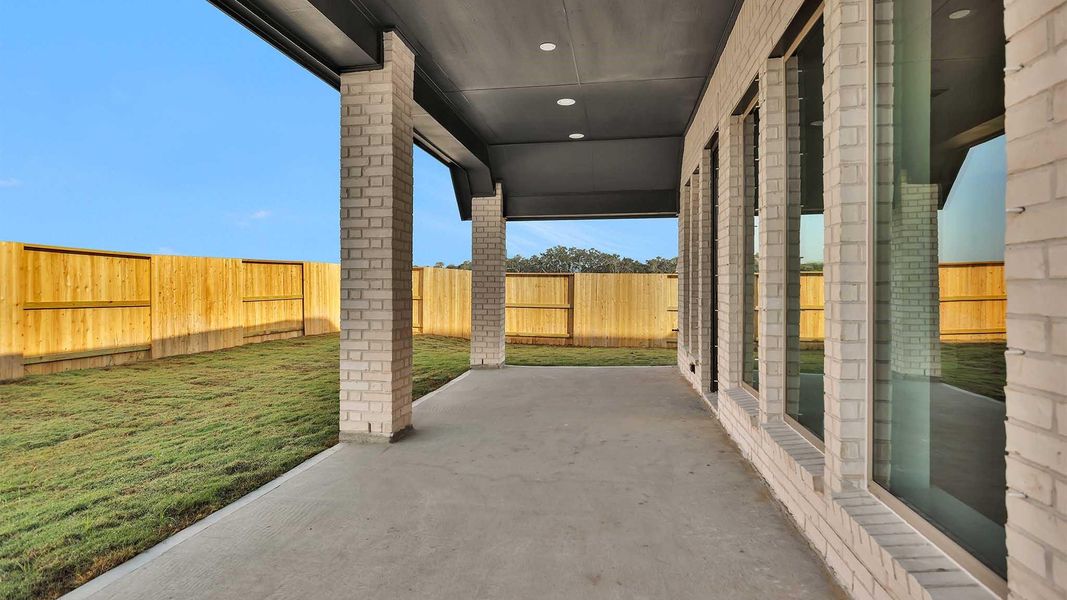 Exterior details and patio area of a home in Serenity 55+ Active Adult, Arcola (Image 3).