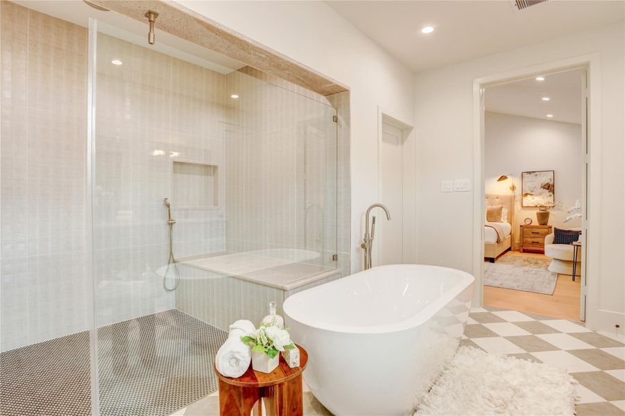 Another angle of the primary bath showcasing the walk-in shower and garden tub.