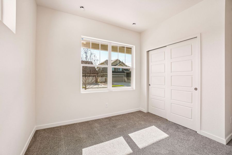 Spacious, unfurnished interior of a new home in Union Colony West, Greeley (Image 42).
