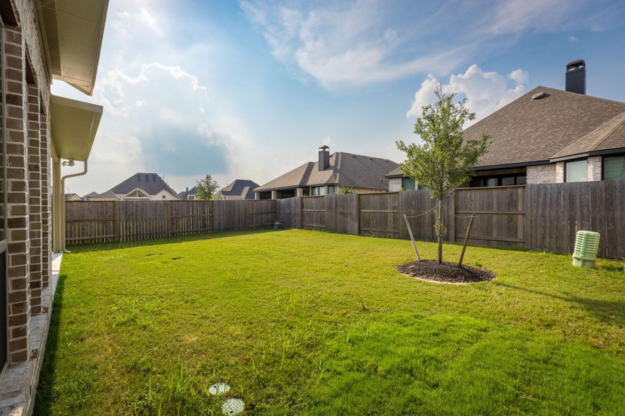 Front exterior of a new home in Cane Island 50', Katy, TX, highlighting curb appeal (Image 24). Front exterior of a new home in Cane Island 50', Katy, TX, highlighting curb appeal (Image 24).