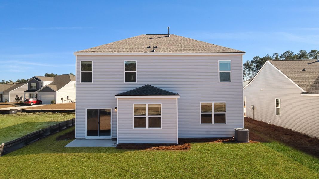 Exterior details and patio area of a home in Pine Hills at Cane Bay, Summerville (Image 3).
