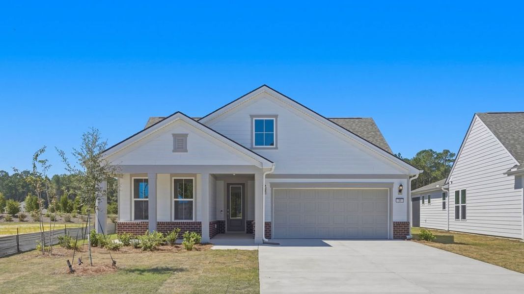 Front exterior of a new home in Sun City Hilton Head, Bluffton, SC, highlighting curb appeal (Image 23). Front exterior of a new home in Sun City Hilton Head, Bluffton, SC, highlighting curb appeal (Image 23).