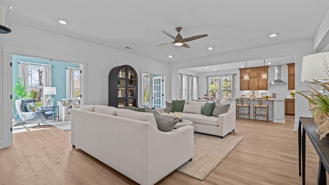 Tasteful family room with high ceilings, modern fixtures, and a warm, inviting feel