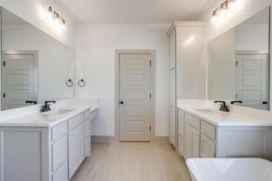 Bathroom with vanity and a tub